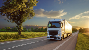 Truck driving at sunset