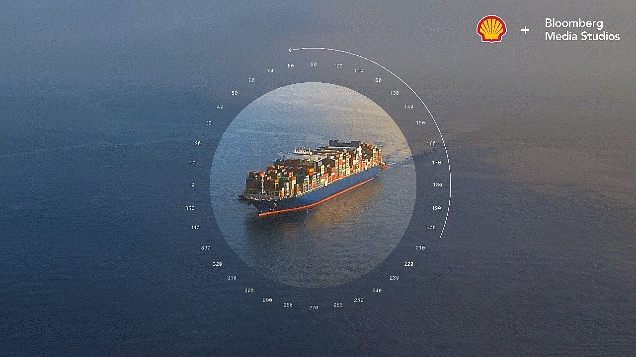 Shipping vessel sailing into distance with compass overlay