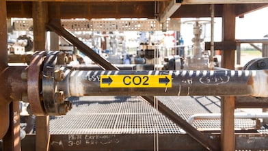 Pipe with a yellow and black CO2 sticker on the side