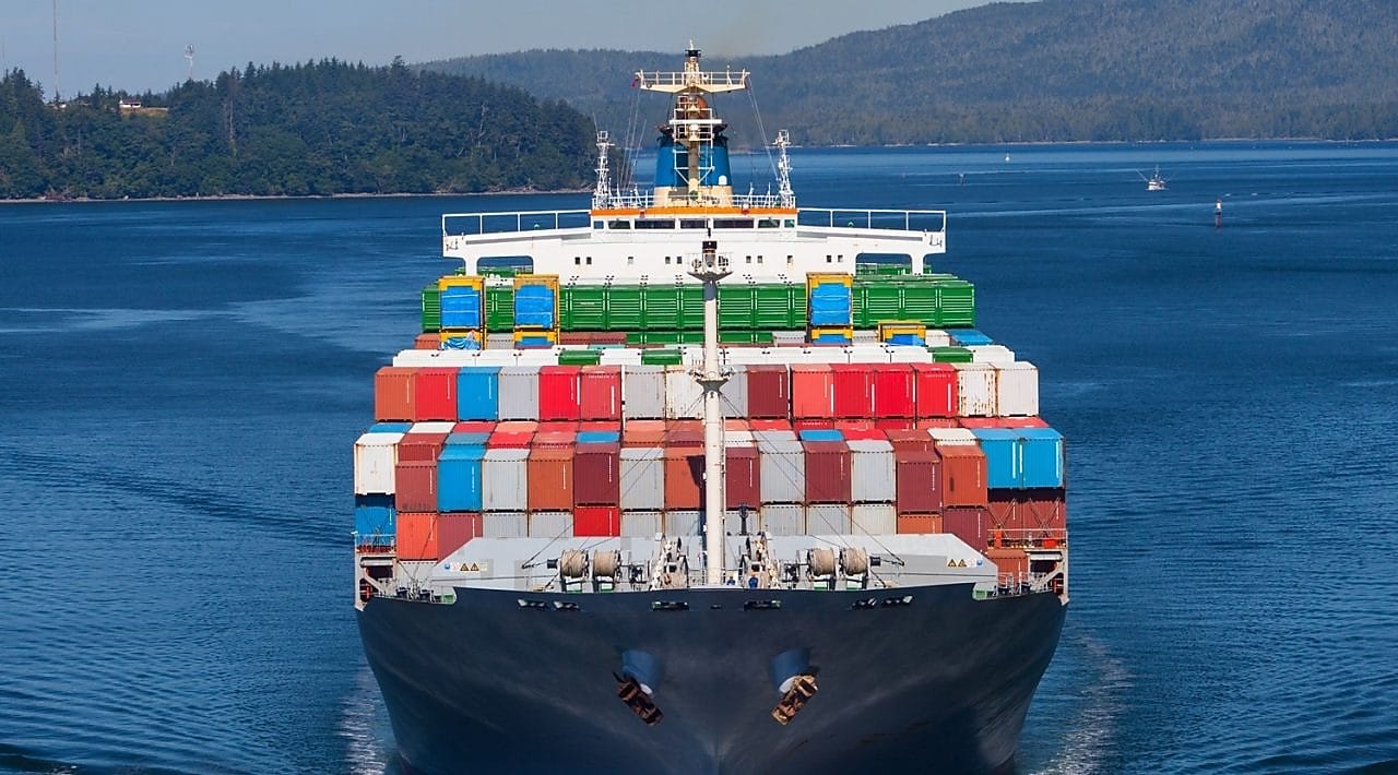Refuelling a tanker from a tug on the Houston shipping channel, USA