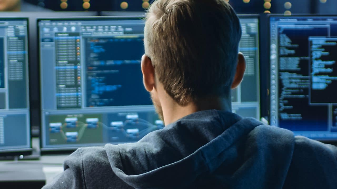 a man looking at computer screen