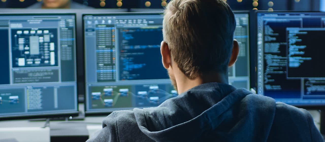 a man looking at computer screen