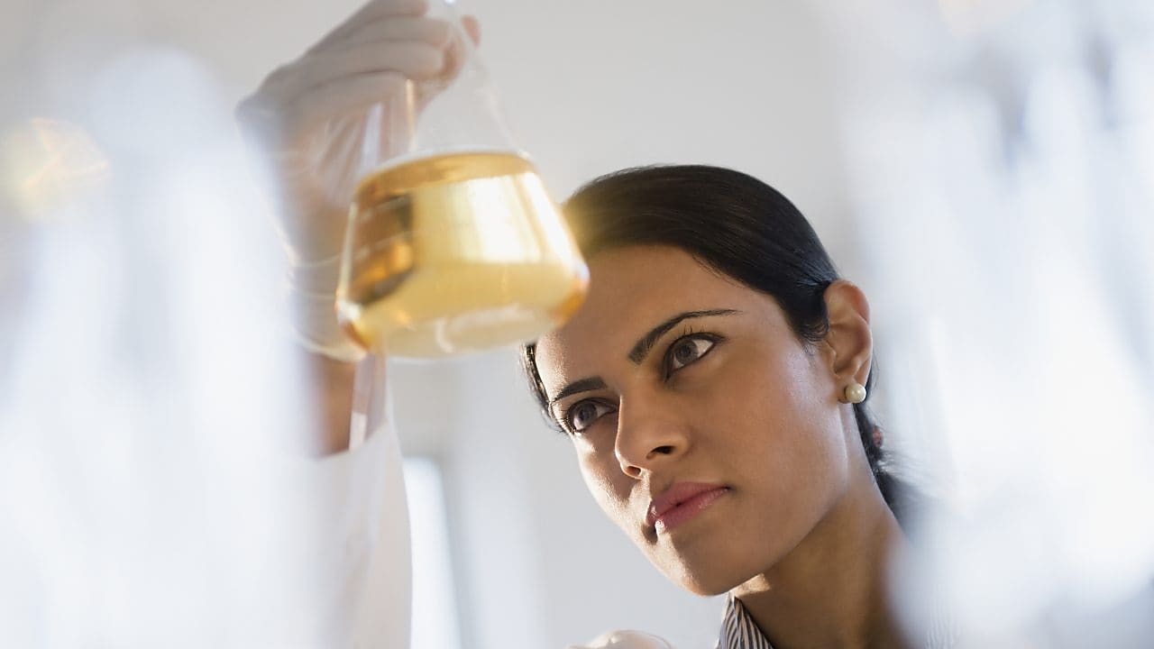 A women seeing in the jar for some experiment