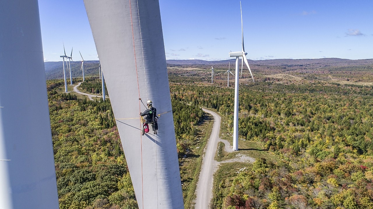 worker checking wind mill