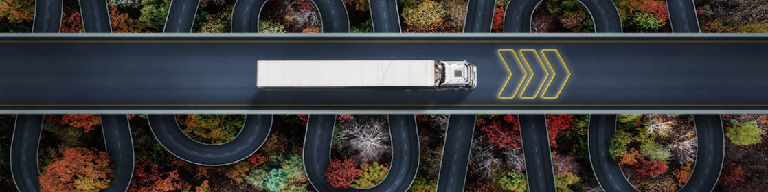 Aerial view of truck driving along a road