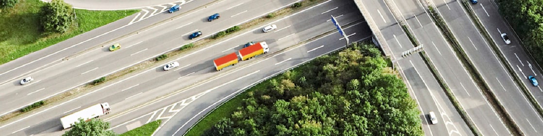 Trucks and cars driving along overlapping highways