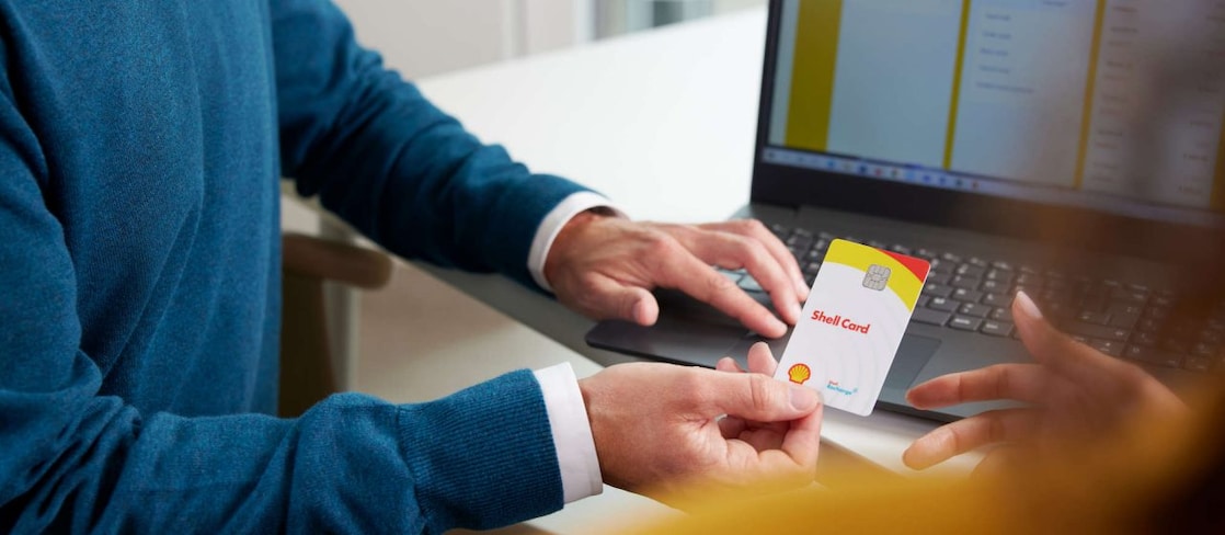 Man holding Shell Card