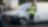 Man standing next to charging vans