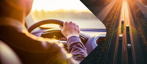 man driving car
