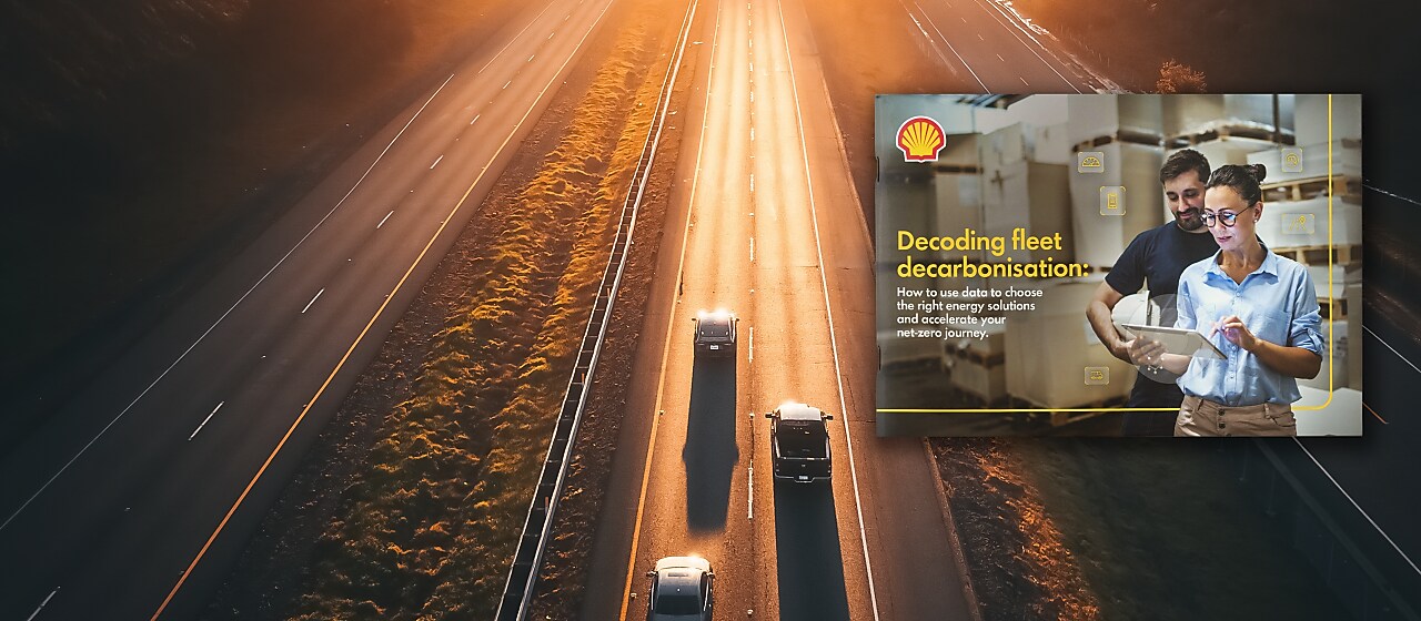 Three cars on a highway in the background with the front page of the "Decoding fleet decarbonisation" report imposed on to the foreground. front page of the report has two people looking at a touchpad with the text "decoding fleet decarbonisation: How to use data to choose the right energy solutions and accelerate your net-zero journey" on the left of the front page.