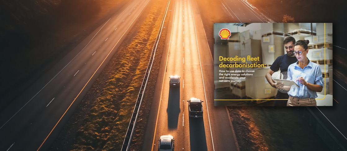 Three cars on a highway in the background with the front page of the "Decoding fleet decarbonisation" report imposed on to the foreground. front page of the report has two people looking at a touchpad with the text "decoding fleet decarbonisation: How to use data to choose the right energy solutions and accelerate your net-zero journey" on the left of the front page.