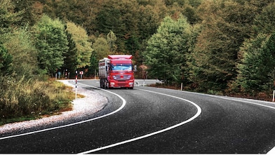 Truck driving in sunlight