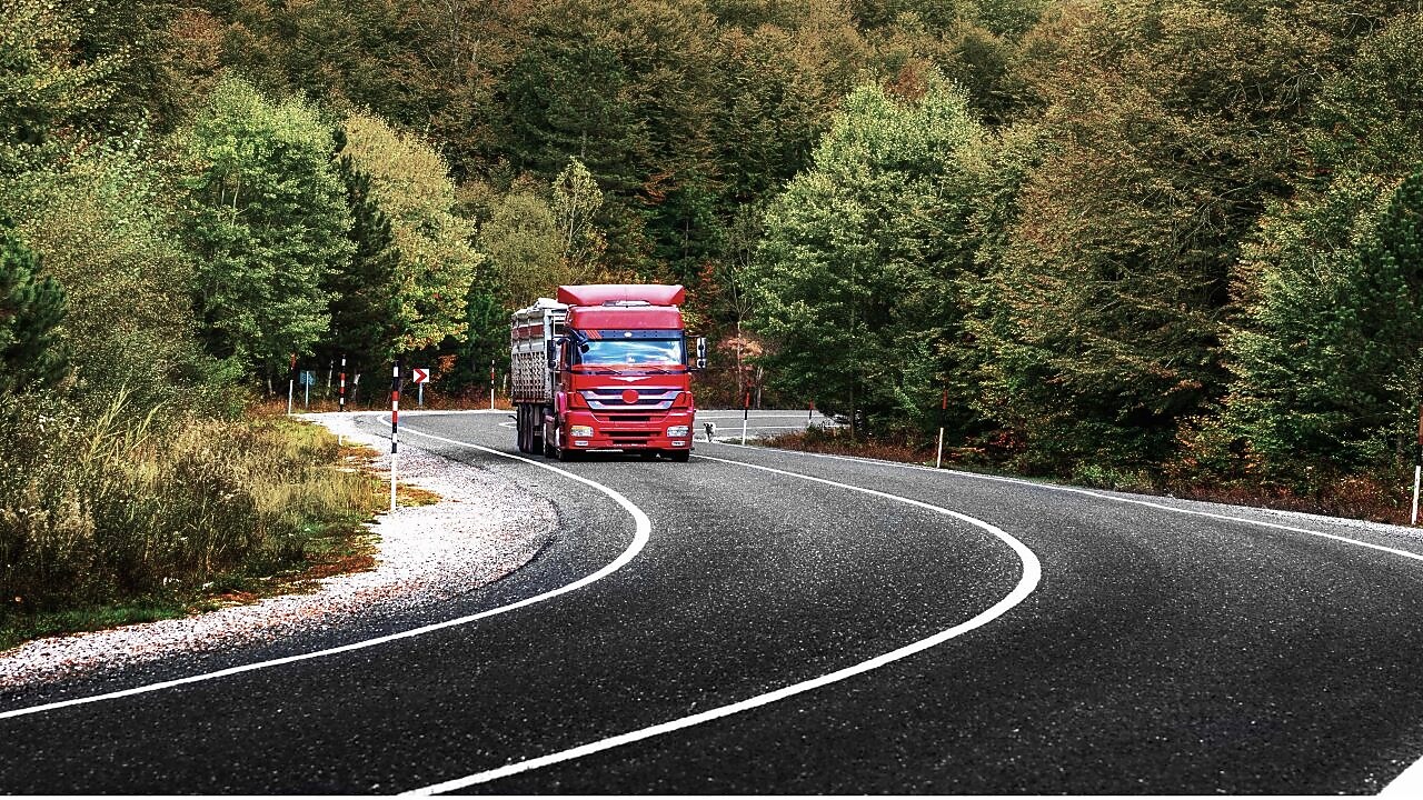 Truck driving in sunlight
