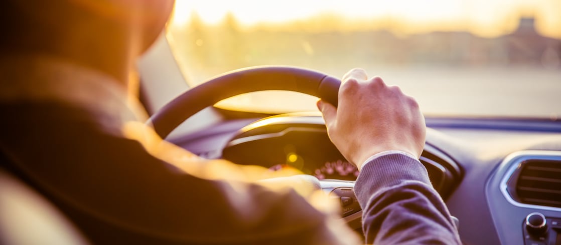 man driving a car