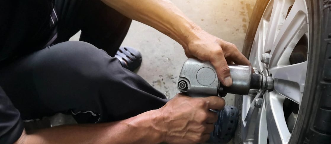 Man filling tyre up with air