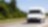  A white van driving down an open road