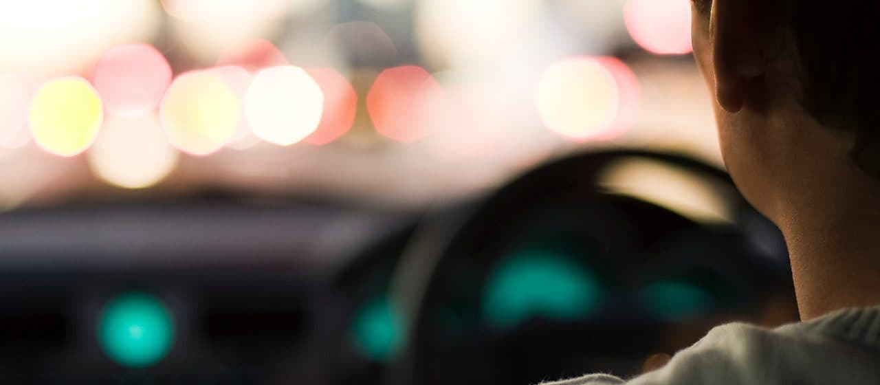 Man driving a car with blurry background