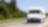  A white van driving down an open road