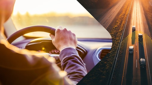man driving on road