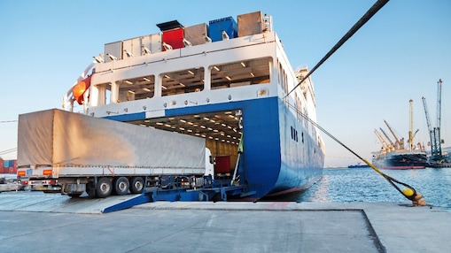 Truck driving on to ferry