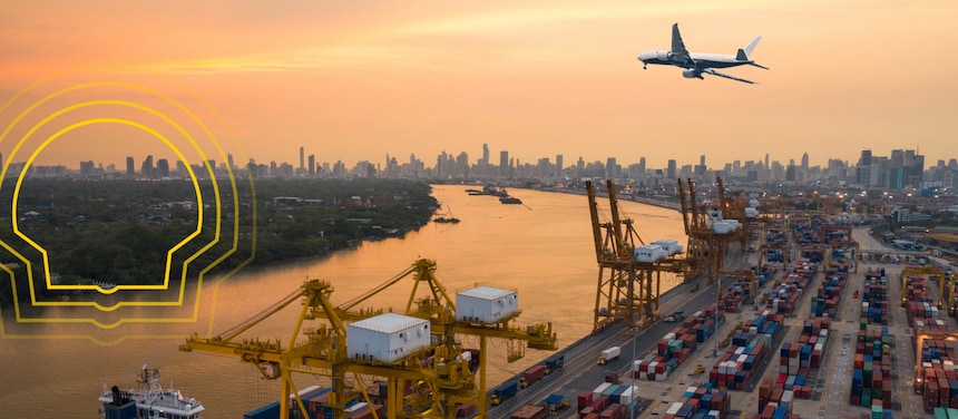 A plane flying over a port side