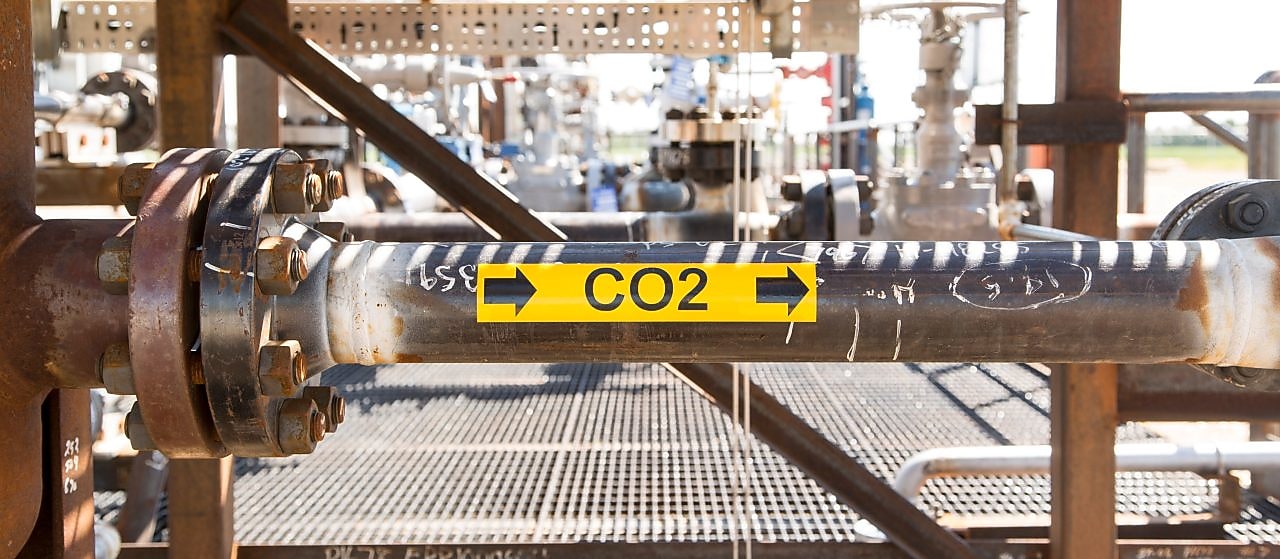 Pipe with a yellow an black CO2 sticker on the side