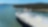 View of the top deck of a ship approaching a harbour.