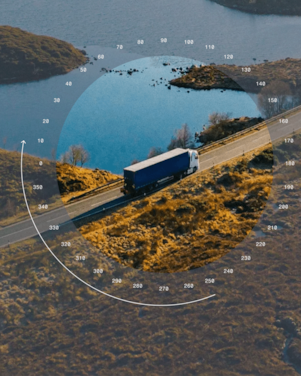 Truck driving along a coastal road with circular overlay graphic.