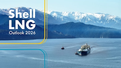 lng tanker in a body of water at the base of mountains