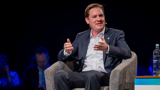 Andy seated onstage during a panel discussion at the World Hydrogen Summit.