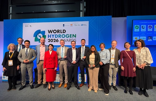 Group of delegates posing onstage at the World Hydrogen Summit 2026 in Rotterdam.