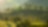 Scenic view of a lush, tree-covered hillside bathed in warm, early morning light.