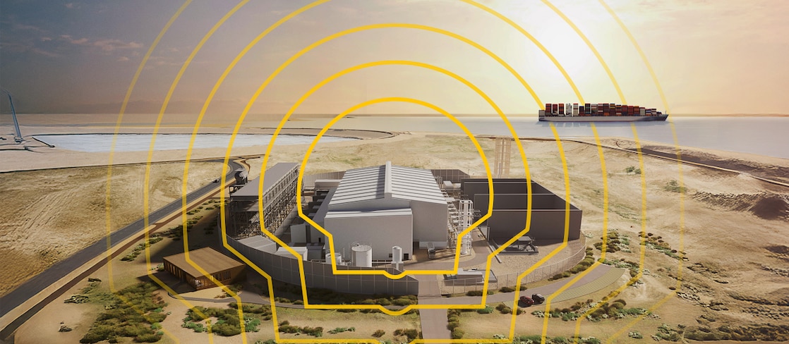 Holland Hydrogen 1 facility near a coastline with a cargo ship in the background, overlaid with a yellow Shell logo design