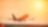 Commercial aeroplane lifting off the runway at sunset, with an orange glow reflecting off the fuselage and sky.