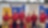 A group of six Shell representatives in red shirts pose together in front of an exhibition booth with Shell branding.