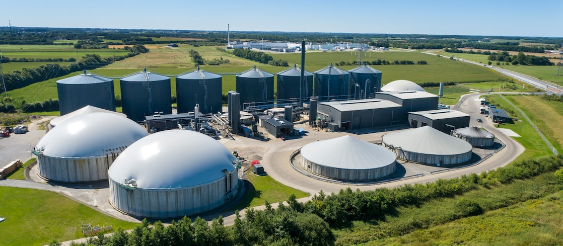 Workers servicing fuel production equipment