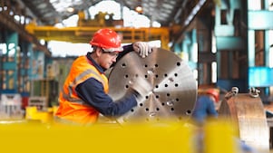engineer working with steel part
