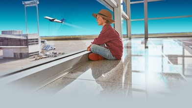boy sitting at airport