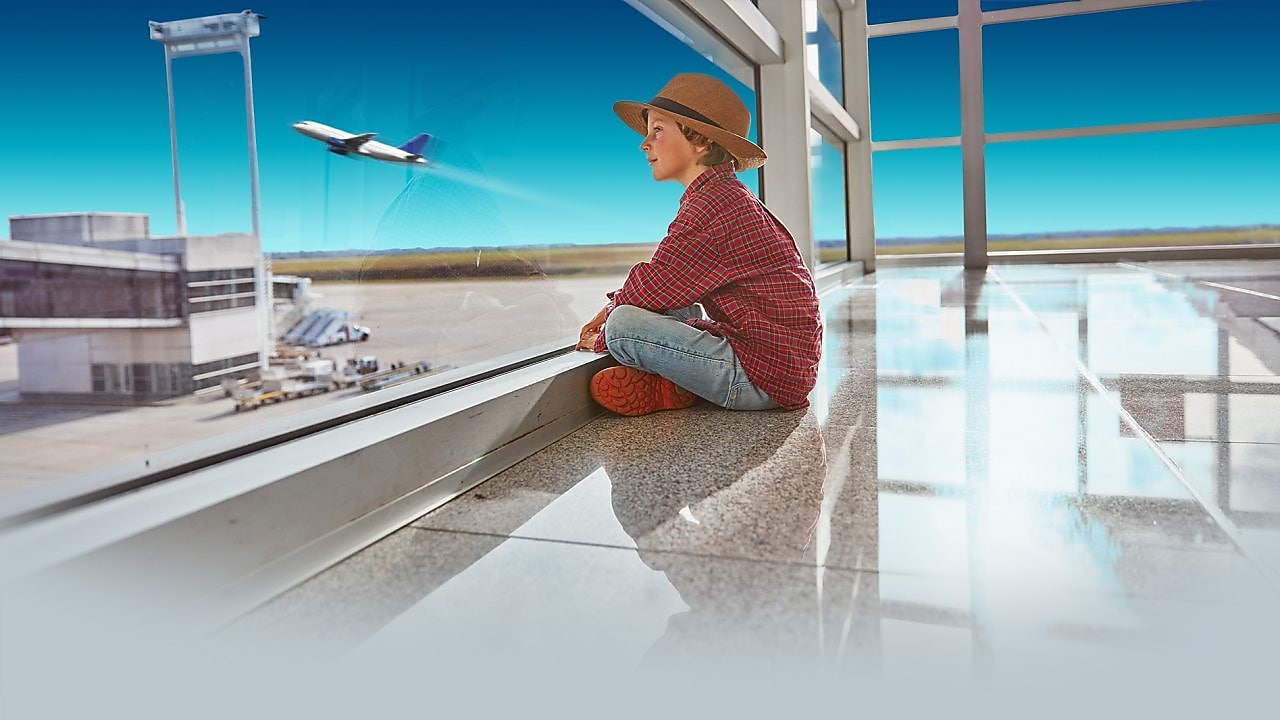 Boy sitting in airport