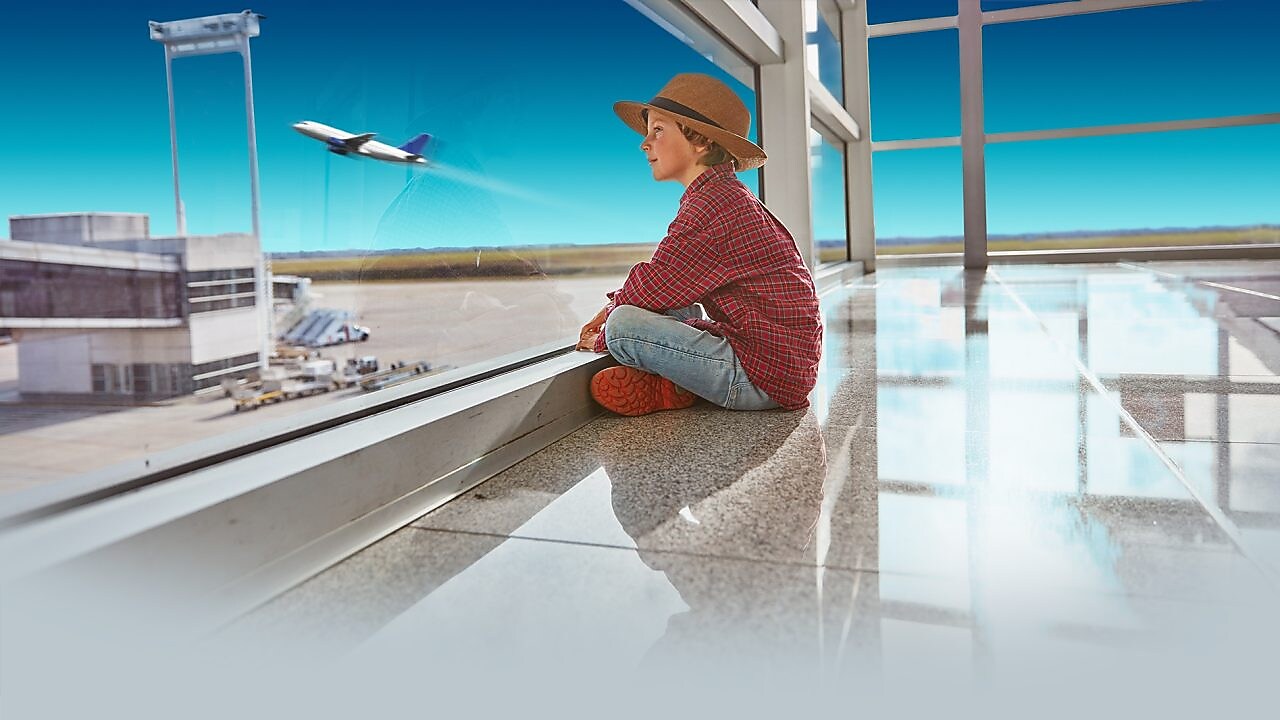 Boy sitting in airport