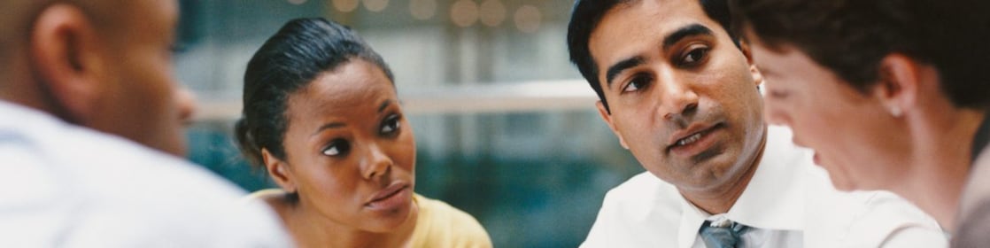 Business People Sitting in an Office Building Having a Meeting