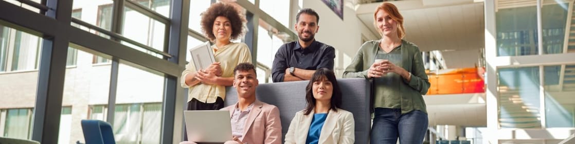 Shell Interns collaborating in a modern, open office environment, showcasing teamwork and innovation as part of the Shell Assessed Internship Programme