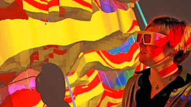 lady wtaching screen with 3d glasses