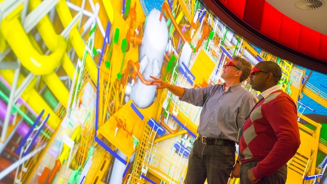 two man watching big screen with 3d glasses