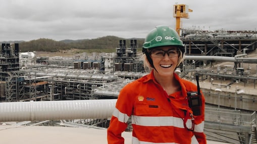 Smiling woman wearing PPE clothing