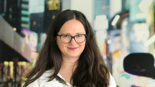 Smiling woman posing on office surroundings