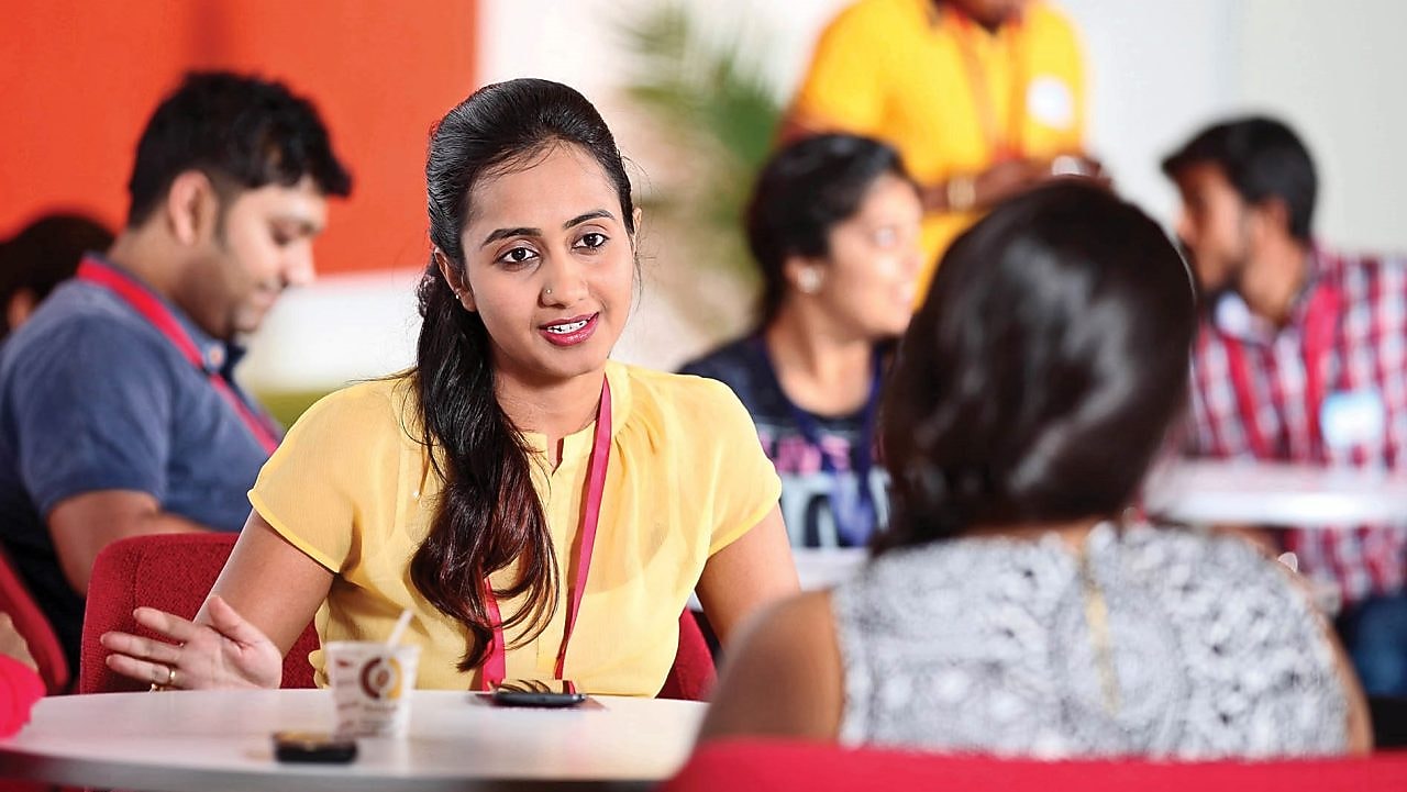 two peers having free time in cafeteria at Shell IT hub in Banglore,India