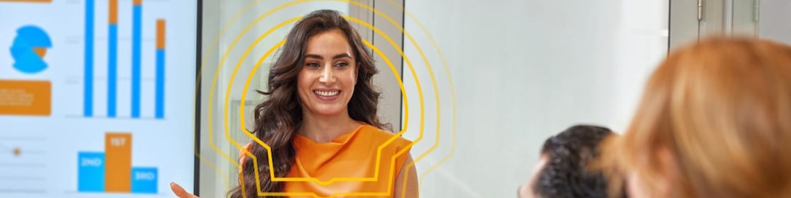 Shell graduate presenting data insights during a team meeting, highlighting leadership and analytical skills in a collaborative workplace.