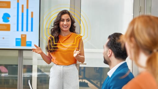 Shell graduate presenting data insights during a team meeting, highlighting leadership and analytical skills in a collaborative workplace.