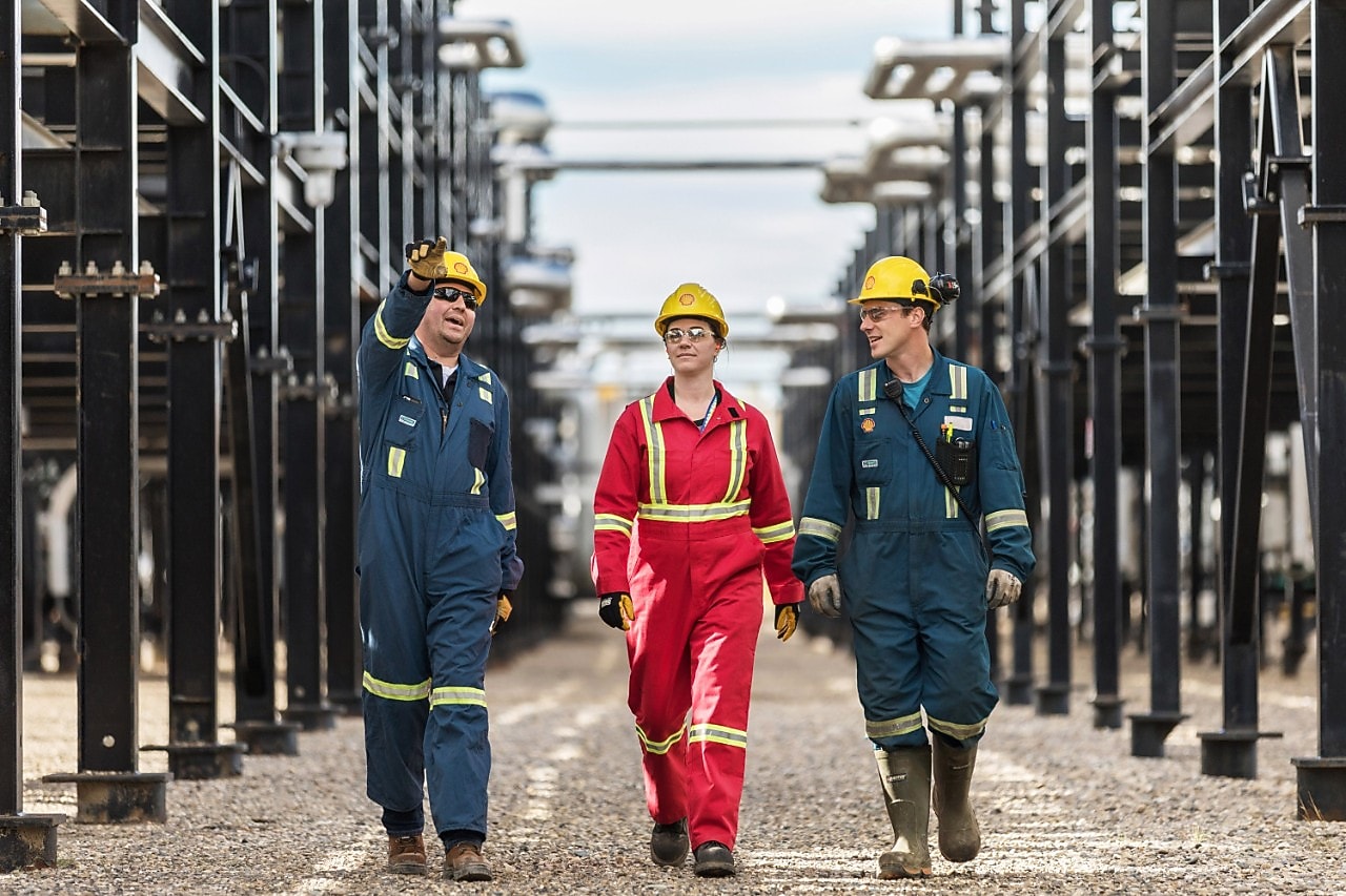 Shell engineers walking together at an operational site
